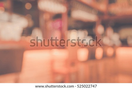 vintage tone image of blur wooden   counter bar in restaurant for background usage.