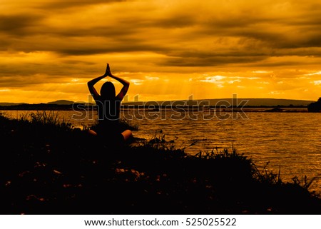 yoga woman meditate on sunset beach