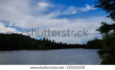 Beautiful spring landscape with lake, trees and blue sky. Composition of nature from Ontario - Canada