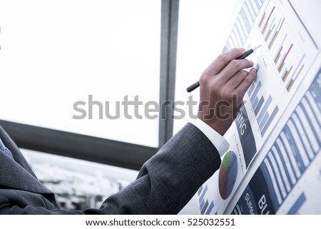 Businessman analyzing investment charts. Accounting