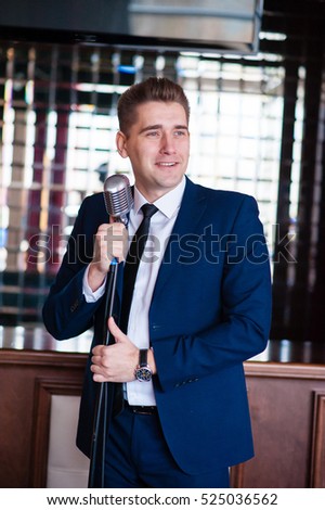 A cheerful man with microphone