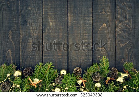 Composition with decorated Christmas tree on dark rustic wooden background with copy space for text. Christmas mock-up or greeting card. Top view