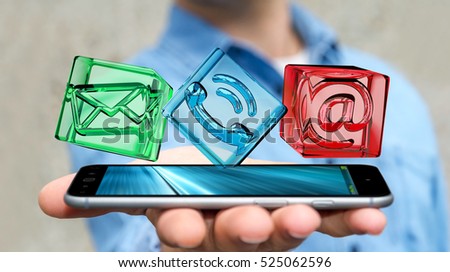 Businessman on blurred background holding transparent cube contact icon over phone 3D rendering