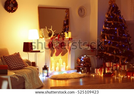 Beautiful living room with fireplace decorated for Christmas