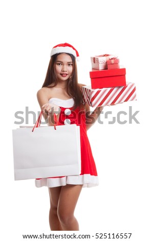 Asian Christmas Santa Claus girl with shopping bags and gift  isolated on white background.