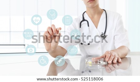 Doctor holding pill medicine close up. Health care and medical icons