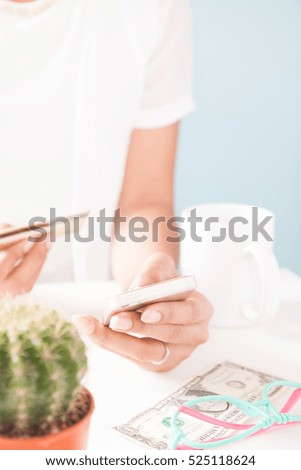 Woman's hands holding mobile phone and credit card. Online shopping