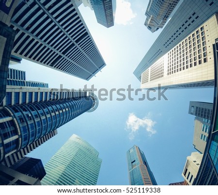 Worm's-eye or  low angle view of several business and financial skyscraper buildings in Singapore.