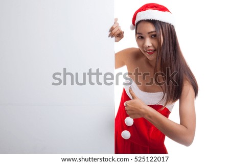 Asian Christmas Santa Claus girl thumbs up with blank sign  isolated on white background.
