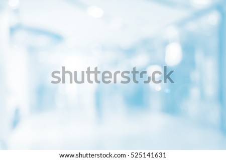 Abstract blurred bright blue color of interior office workplace background concept.