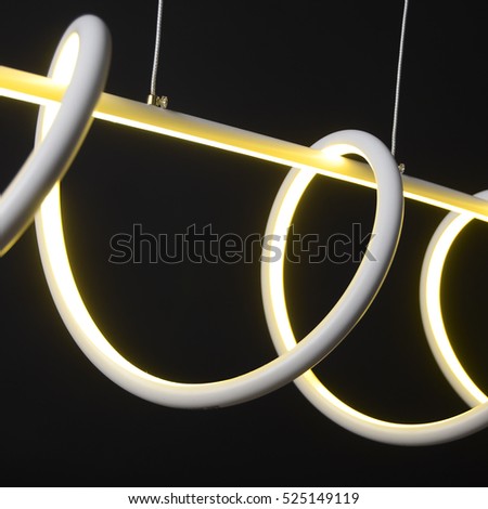 LED chandelier isolated on black background switch on