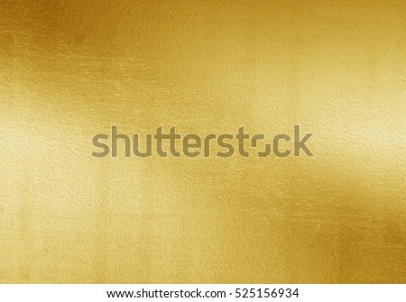 Shiny yellow leaf gold foil texture background Royalty-Free Stock Photo #525156934