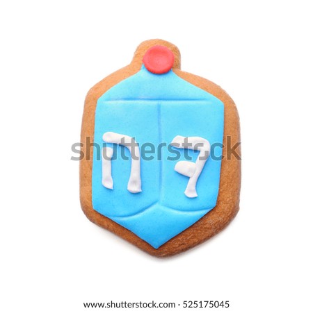 Tasty glazed cookie for Hanukkah, on white background