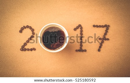 2017 coffee beans on paper texture in vintage style for new year concept