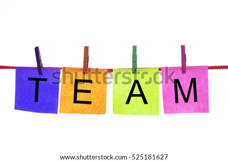 Colorful paper cards with words TEAM hang on rope isolated on white.