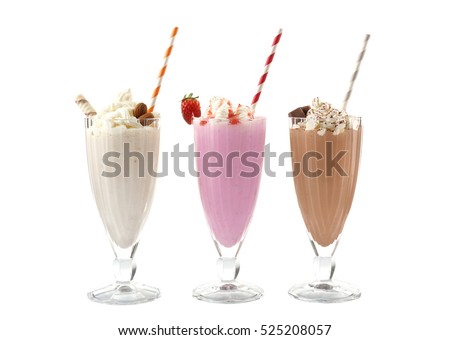Delicious milkshakes isolated on white Royalty-Free Stock Photo #525208057