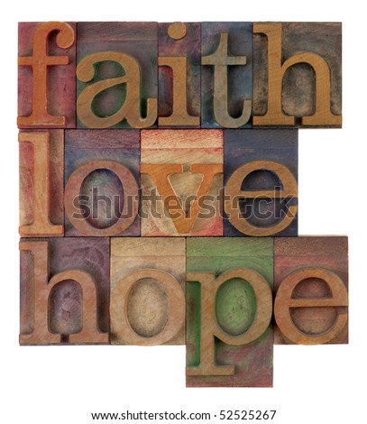 biblical, spiritual  or metaphysical reminder - faith, hope and love in old wooden letterpress type blocks, stained by colorful inks, isolated on white Royalty-Free Stock Photo #52525267