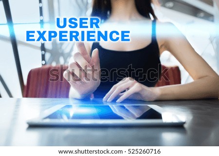 Woman is using tablet pc, pressing on virtual screen and selecting user experience.