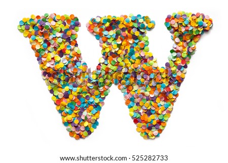The letter W is laid out colored confetti. White background.