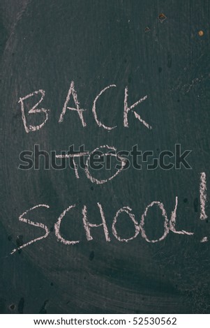 Background of blackboard with a text back to school written on it