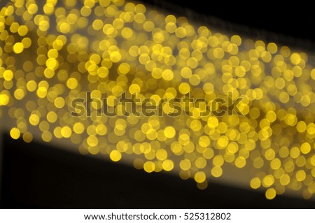 Christmas background. A lot of yellow lights in bokeh.