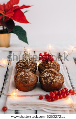 Festive Christmas Muffins on White Shabby Chic Table with Fairy Lights