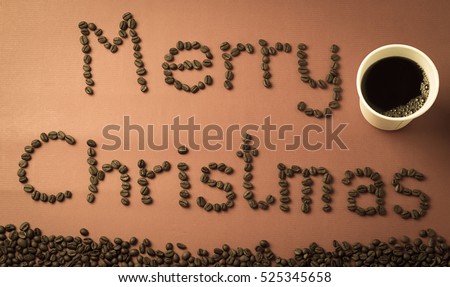 "Merry Christmas" coffee beans on red paper texture