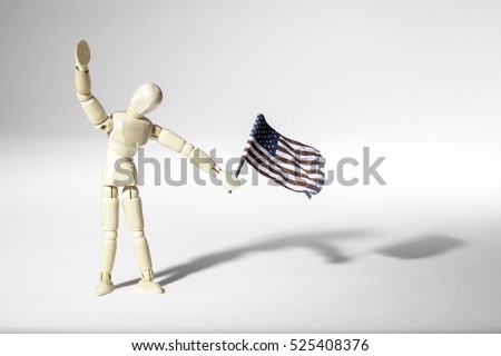 Average patriotic American represented by an faceless mannequin doll waving a USA flag. Connotations of citizenship, patriotism and illegal immigration.
