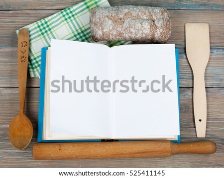 Open blank cook book, hardback books on wooden table. Copy space for ad text. Education business concept. Old blank recipe book on wooden background.