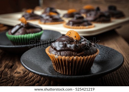Tasty and fresh - homemade chocolate muffins. Shallow depth of field.