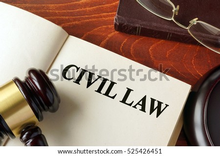 Book with title civil law on a table.