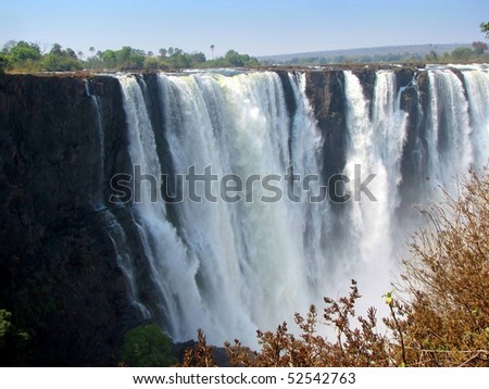 Victoria Falls seen from the side of Zimbabwe Royalty-Free Stock Photo #52542763