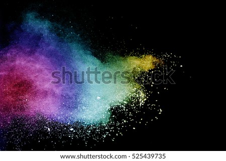 abstract powder splatted background,Freeze motion of color powder exploding/throwing color powder, multicolor glitter texture on black background.