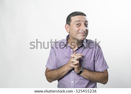 Portrait of a man making funny face against white background
