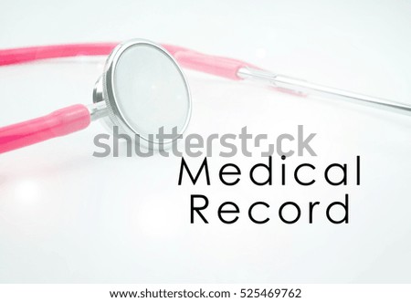 Conceptual image with word MEDICAL RECORD with the view of pink stethoscope on the white background. Medical conceptual. copy space