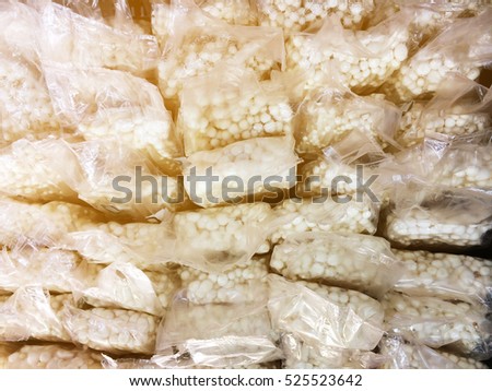 picture of golden needle mushrooms in the supermarket at sales shelf, wrap in the plastic package, the idea of protein from vegetables