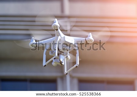 The drone with the professional camera takes pictures.
