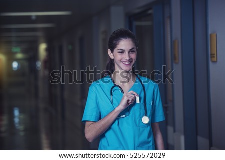 woman doctor or nurse is feeling satisfied while working night shift at the hospital Royalty-Free Stock Photo #525572029