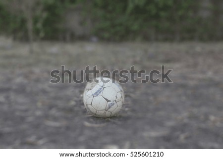 old football on the ground. picture  blur.