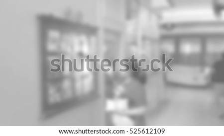 Blurred abstract background of People took leaflets, in-store advertising.