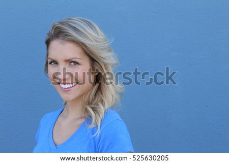 Happy young woman looking at camera with smile
