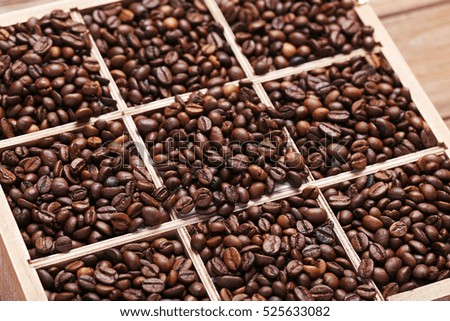 Roasted coffee beans in wooden basket