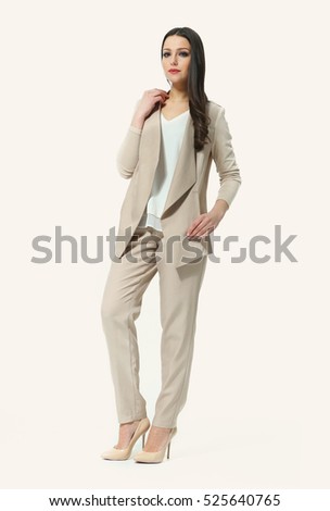  eastern  woman with straight pony tail hair style in office jacket troursers casual linen suit high heel shoes going full body length isolated on white
