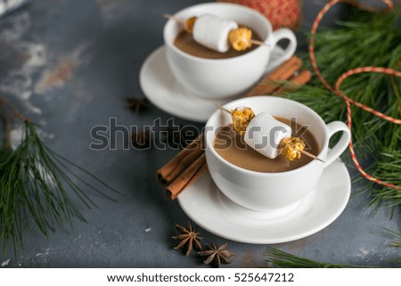 cocoa with marshmallows in a cup in the winter Christmas table