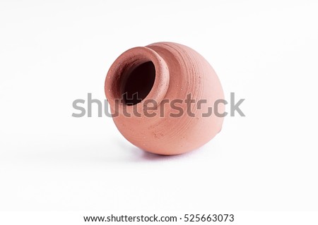 Kvevri qvevri ancient georgian Clay pottery for wine on white isolate background. Kvevri is a large earthenware vessel used for the fermentation and storage of wine, often buried below ground level. Royalty-Free Stock Photo #525663073