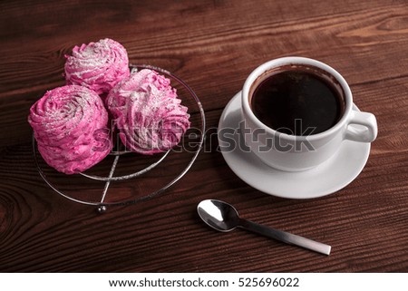 Black coffee and pink zephyr. marshmallow. Sweet pink marshmallow - zephyr and cup of Coffee. Christmas Still Life. Winter drink theme. Romance. Provencal still life. Good morning