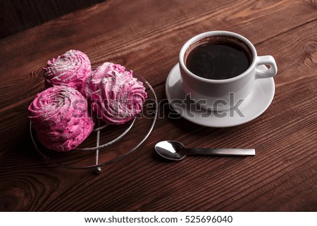 Black coffee and pink zephyr. marshmallow. Sweet pink marshmallow - zephyr and cup of Coffee. Christmas Still Life. Winter drink theme. Romance. Provencal still life. Good morning