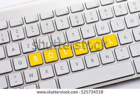 SOLEIL writing on white keyboard