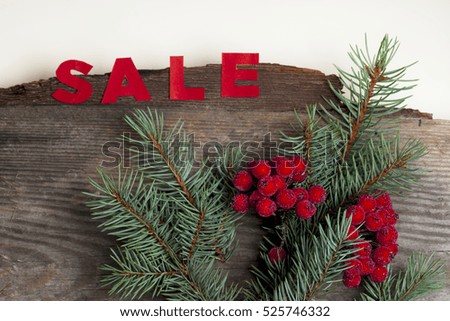 hot Sale on a rustic wooden isolated on white background. Christmas Gift. Copy space for text.