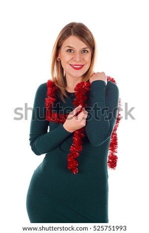 Picture of a beautiful young woman rounded by Christmas decoration on an isolated background